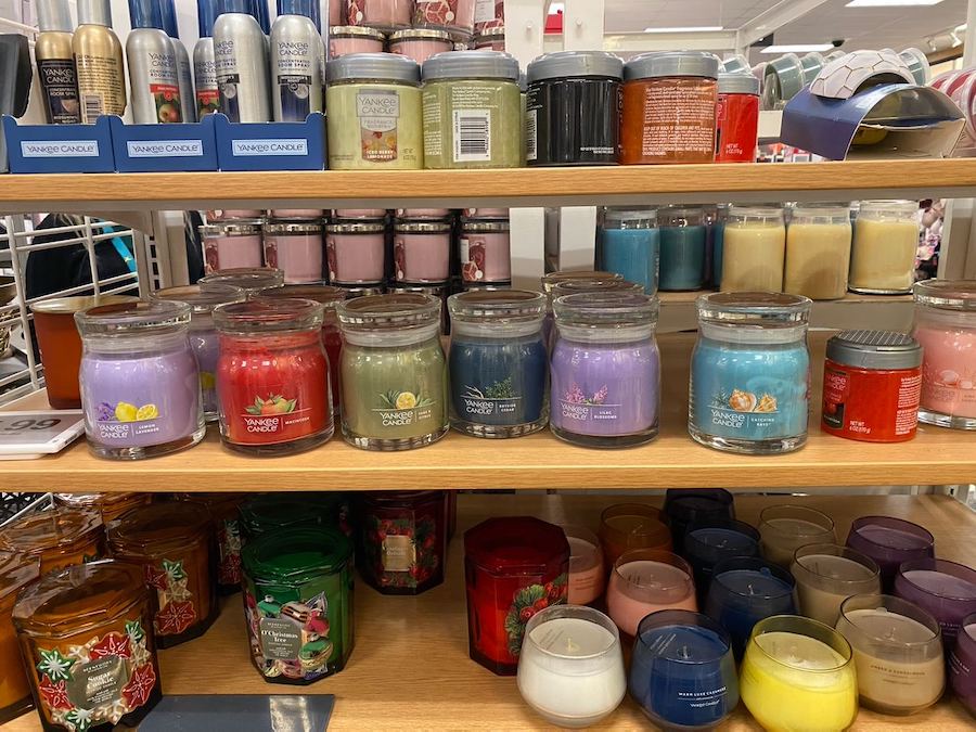 Experience the flickering warmth and inviting ambiance created by Yankee Candles, transforming any space into a cozy retreat.