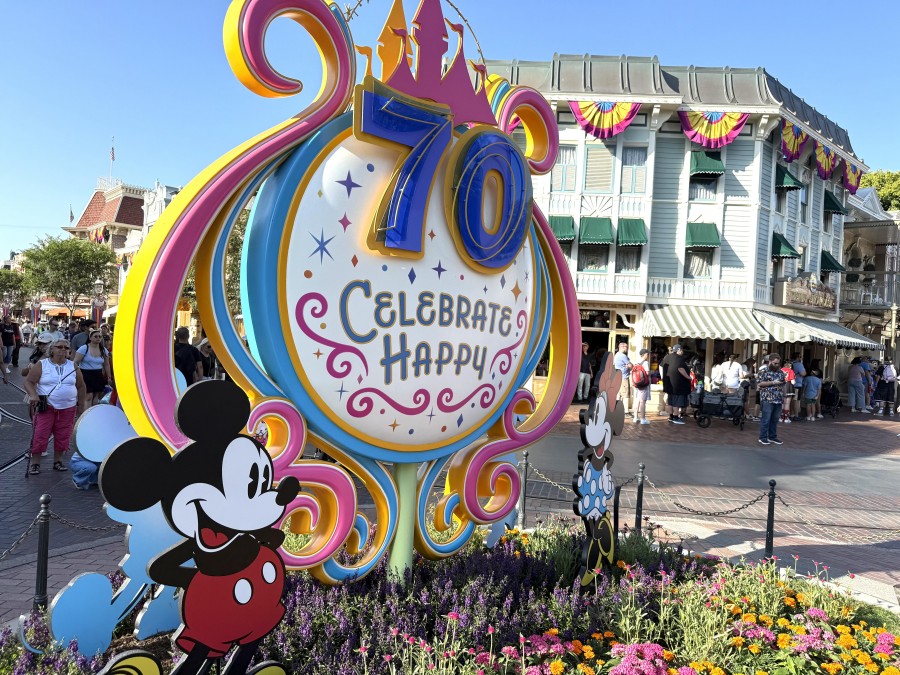 Guests soak in the magic of Disneyland’s 70th Anniversary, celebrating with vibrant décor and joyful entertainment.
