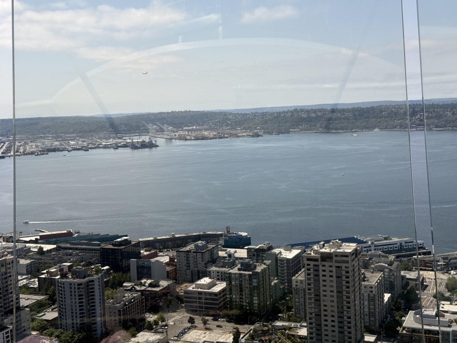 From the top of the Space Needle, visitors take in sweeping panoramic views of Seattle’s skyline