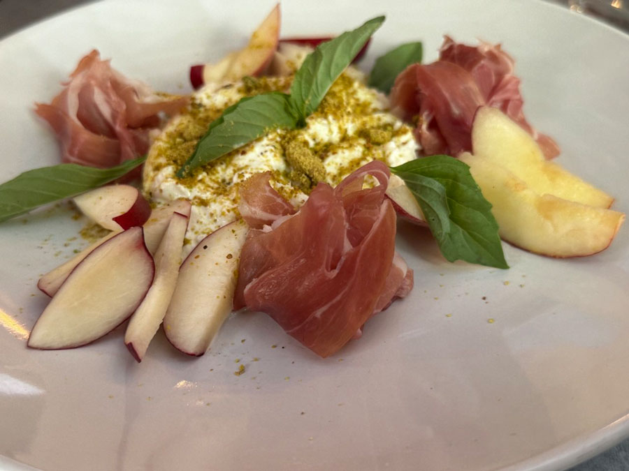 Seasonal Peach and Prosciutto Salad at The Pony Club Bar & Loung