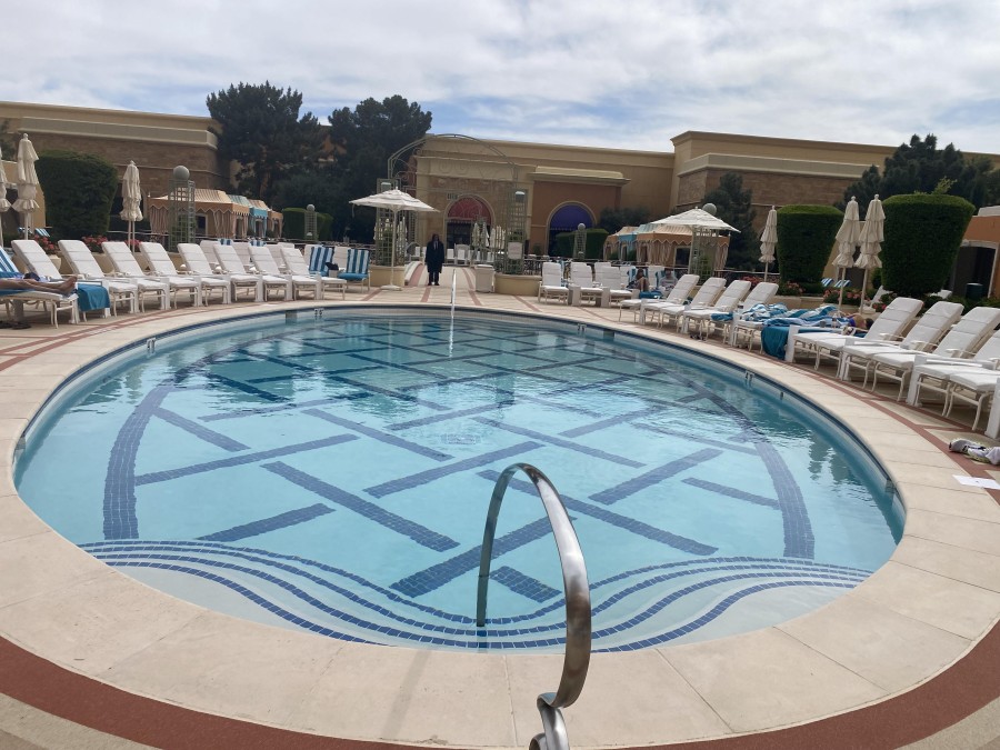 Sunlit calm of spacious oval pool.