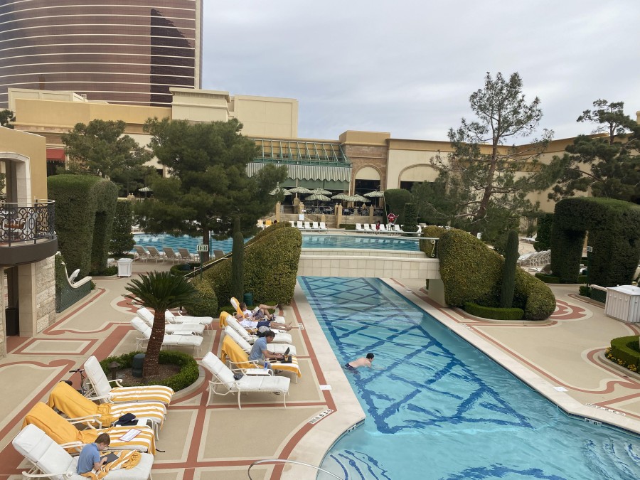 Wynn’s tropical-style pool oasis offers a serene escape, complete with kid-friendly zones and relaxing cabanas.