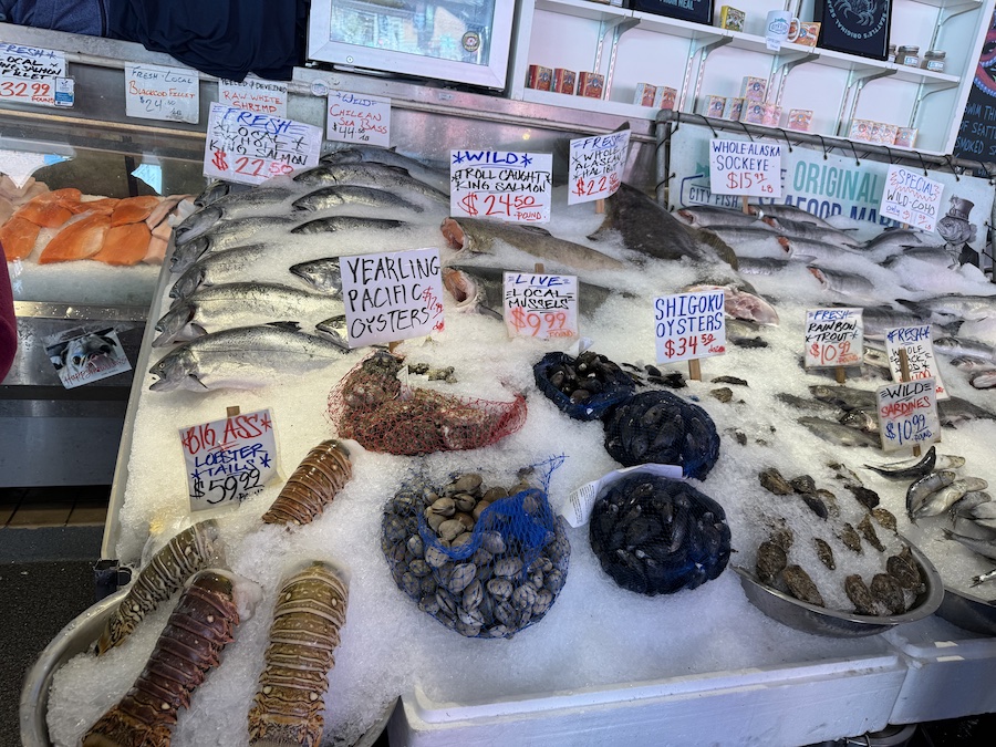 Whole fish, lobsters, and clams on display at the City Fish Company stall.