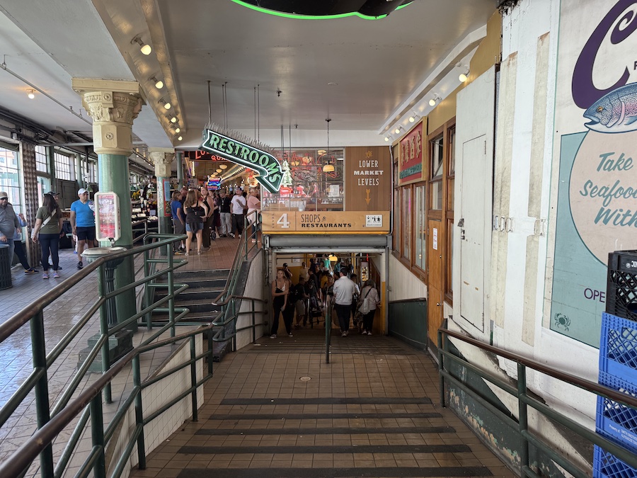 Tourists admiring seafood selections at City Fish Company – capturing the market’s bustling, interactive atmosphere.