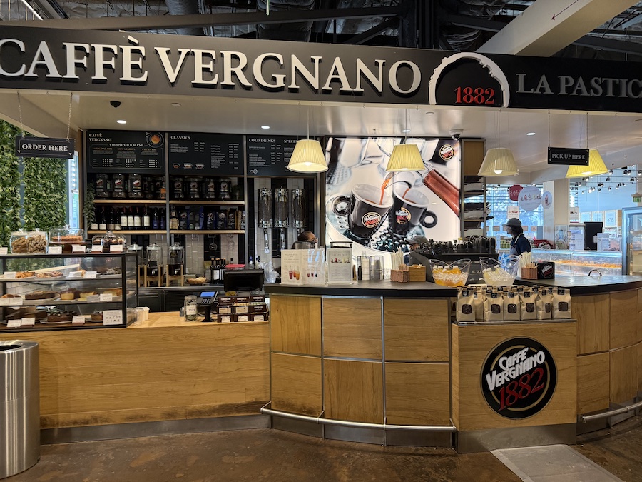 Cozy Caffè Vergnano bar with a bright seating area and espresso station .