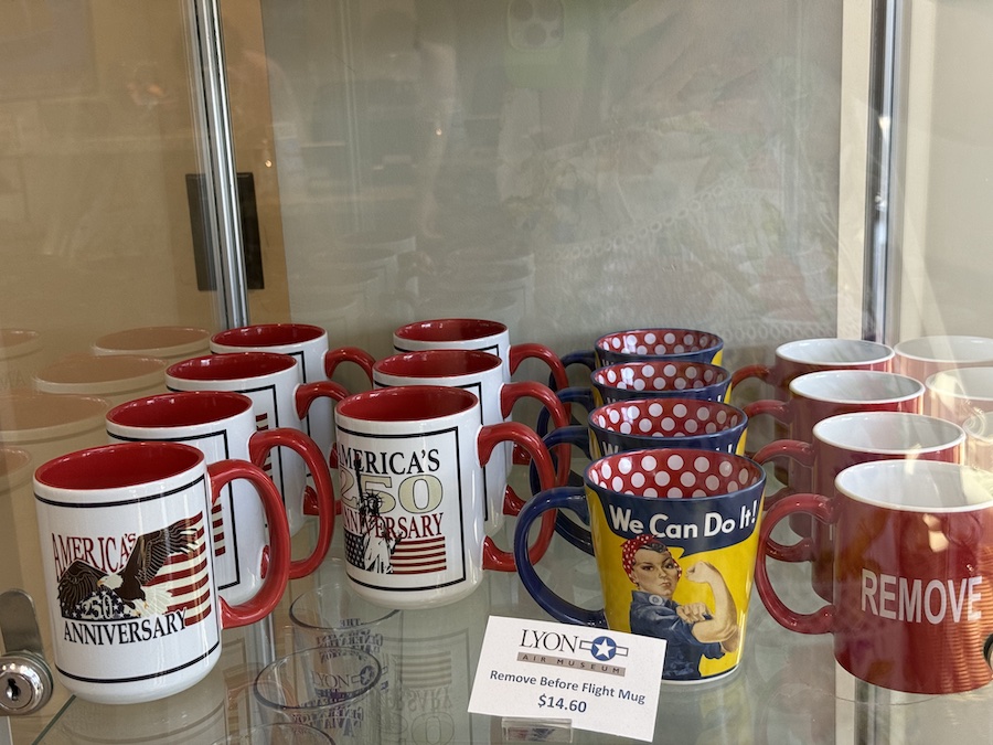 Lyon Air Museum gift shop counter with unique mugs.