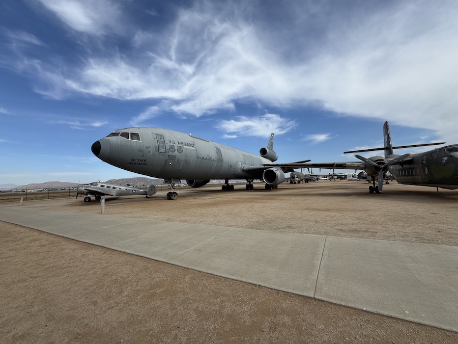 Vintage aircraft displayed at March Field Air Museum under clear blue skies.