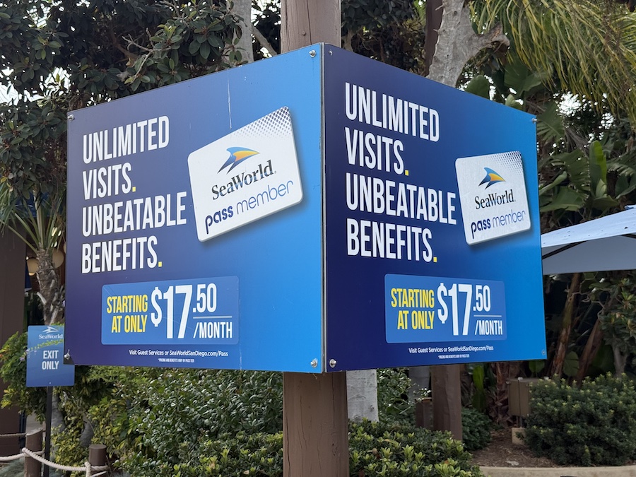 Information board at SeaWorld San Diego showing pass member pricing.