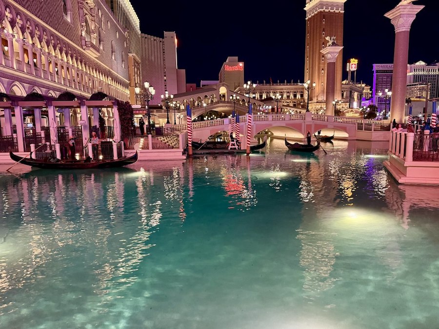 A gondola passes under a replica of the Rialto Bridge in the Venetian's shopping district.