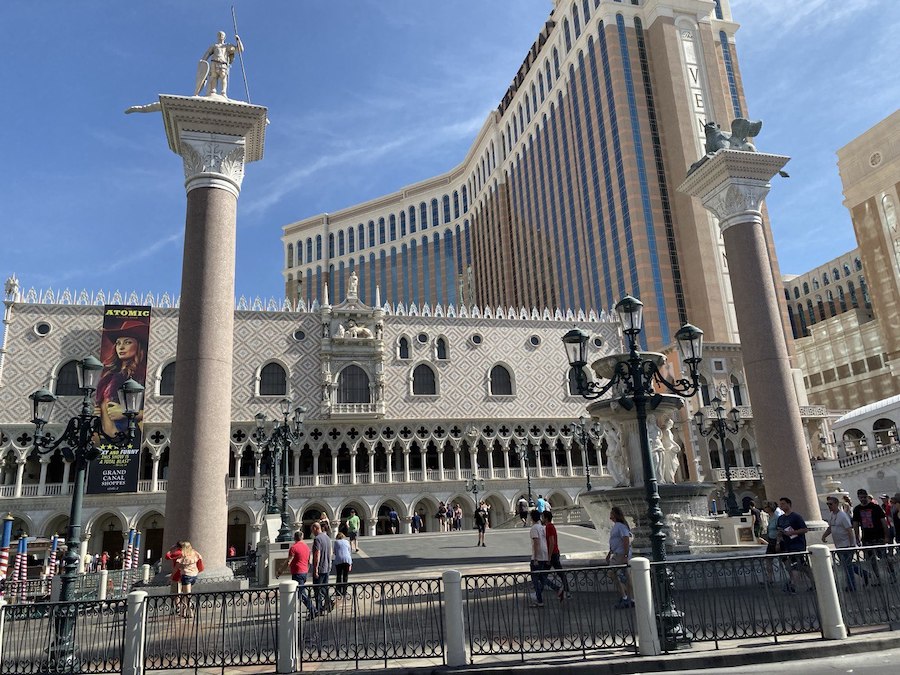 The vibrant colors and details of a replica Venetian building facade in the shopping area.