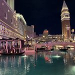 An evening gondola ride lit by lanterns, offering a romantic experience inside The Venetian Resort Las Vegas.