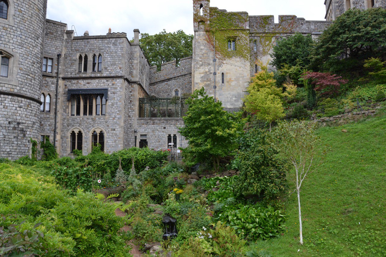 A scenic shot of the castle gardens in bloom with the castle in the background.