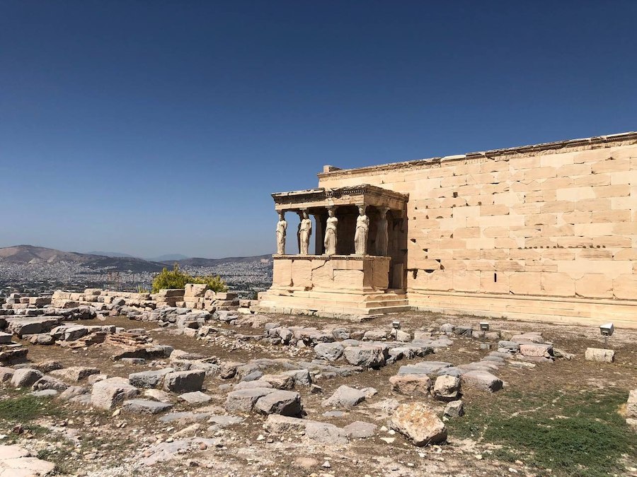 The Erechtheion with its famous Caryatid statues against the skyline.