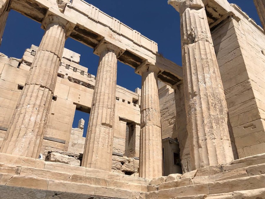 Close-up of detailed carvings on the Parthenon ruins.