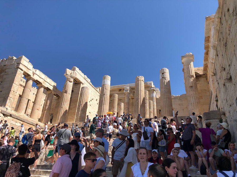 Historic ruins of the Acropolis with detailed carvings and weathered stone.