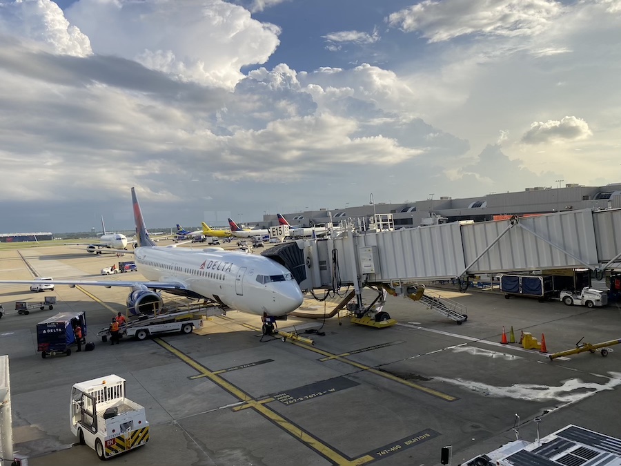 Airplanes lined up on the runway and gates at Hartsfield-Jackson Atlanta International Airport.