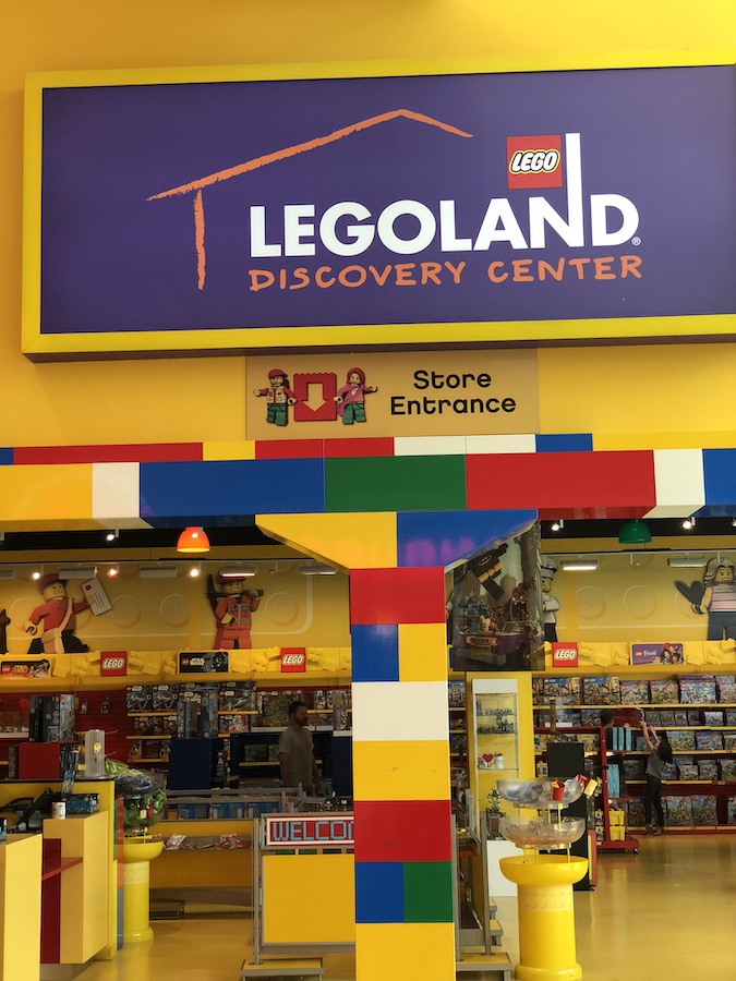 Bright Lego models and hands-on play zones where children build and explore themed attractions.