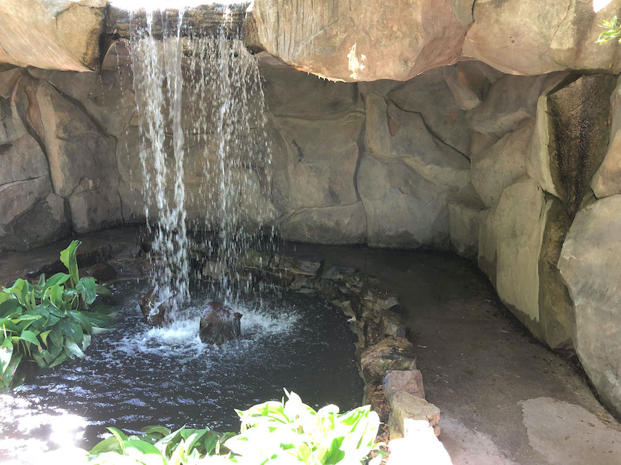 Small waterfall in the park on a sunny day.