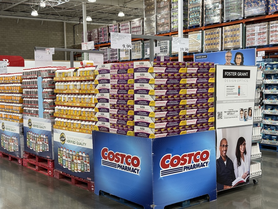 Costco Pharmacy counter offering prescriptions and health products inside the store.