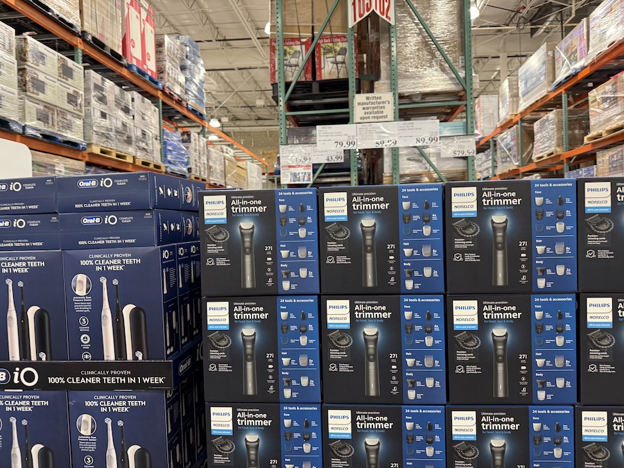 Rows of discounted electronics showcased at the center of Costco.