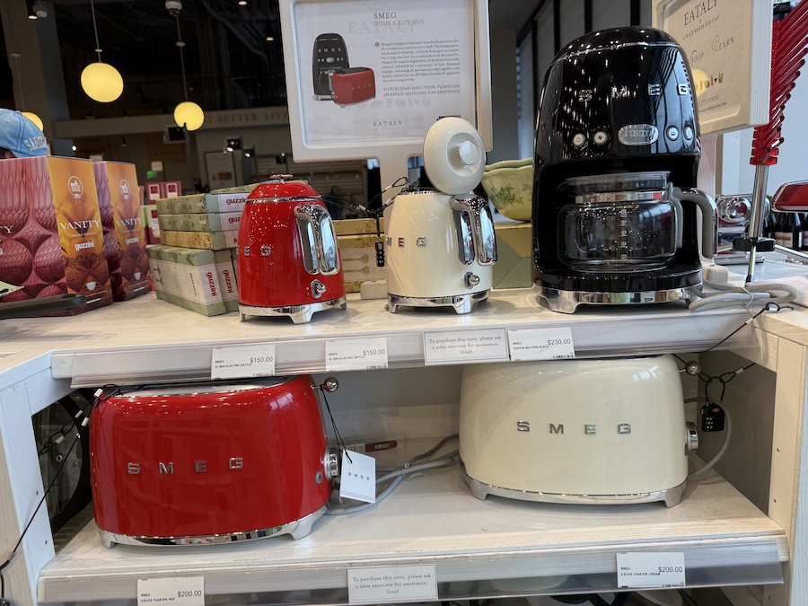 Elegant Smeg kitchen appliances on the shelves of Eataly.
