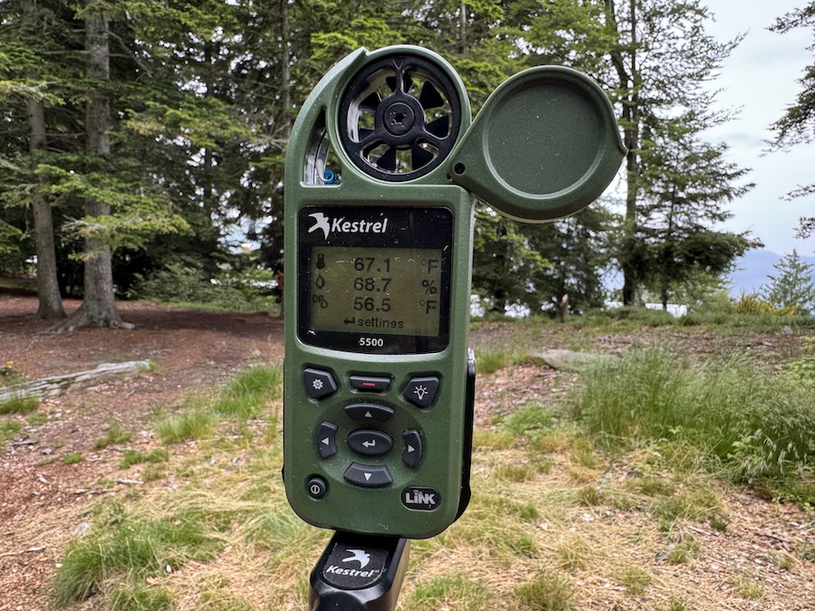 A close-up shot of a green, handheld Kestrel 5500 weather meter.