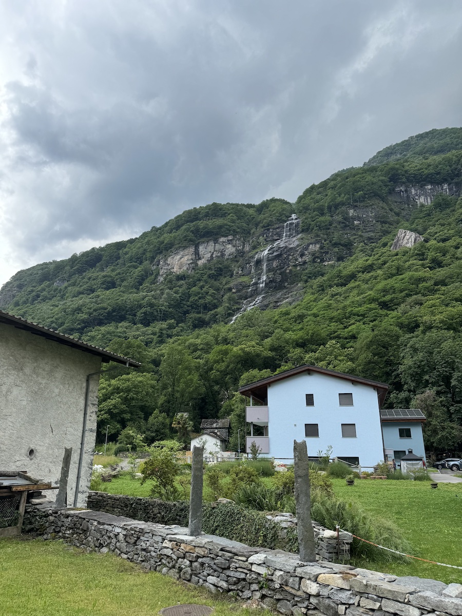 Majestic Alps towering over quiet cottages.