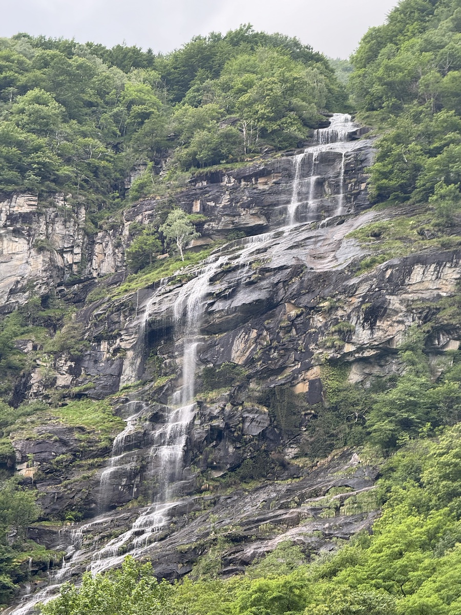 Majestic waterfall cascading down mountain cliffs.