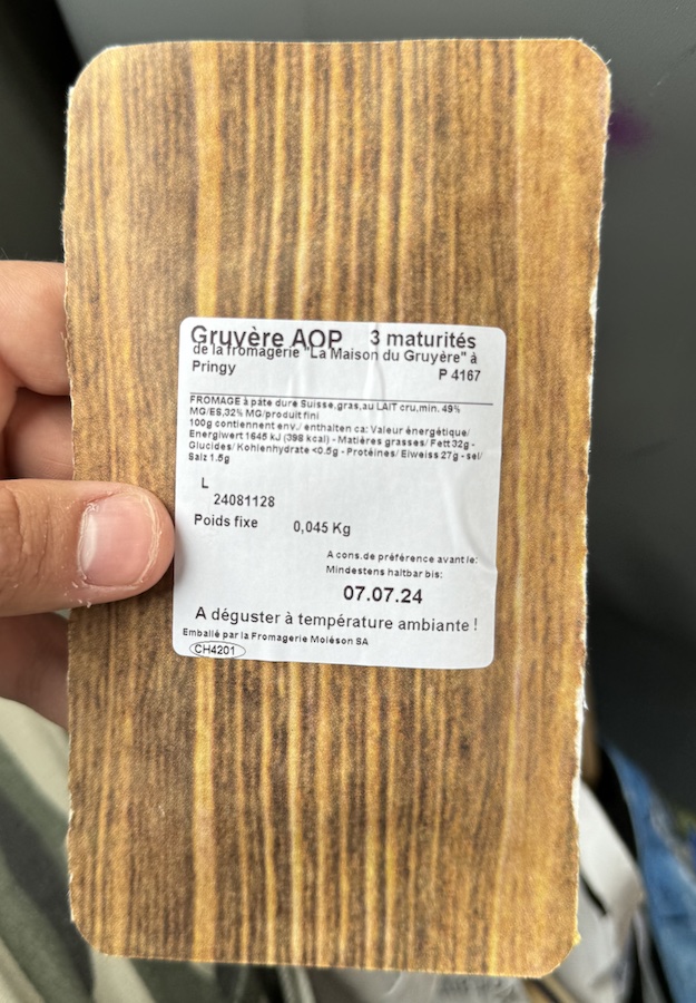 Label on a packaged piece of cheese.