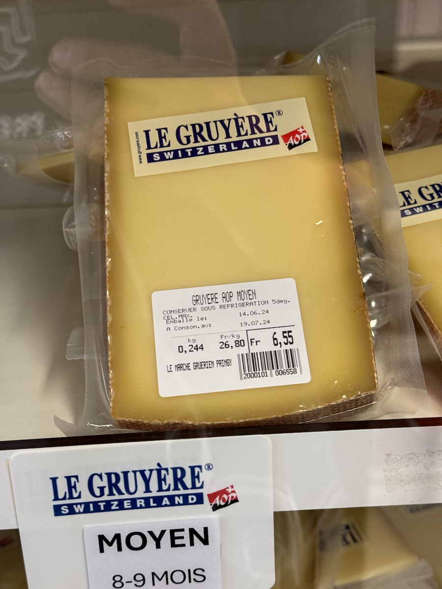 The store features cheeses of various ages.