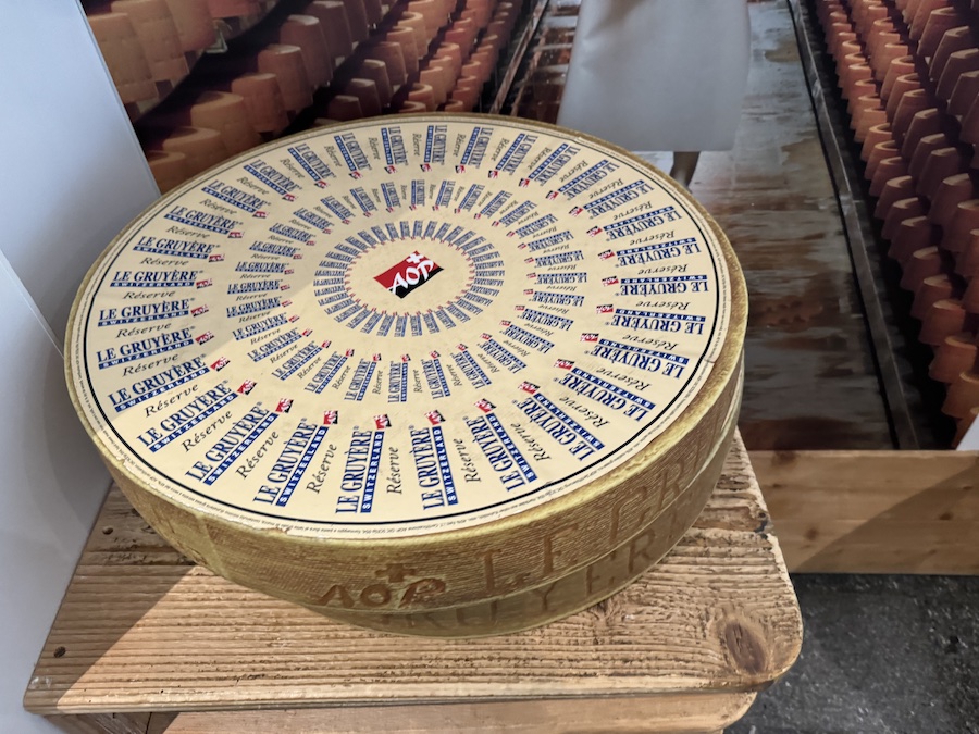 Ready-made heads of delicious cheese on the shelf.