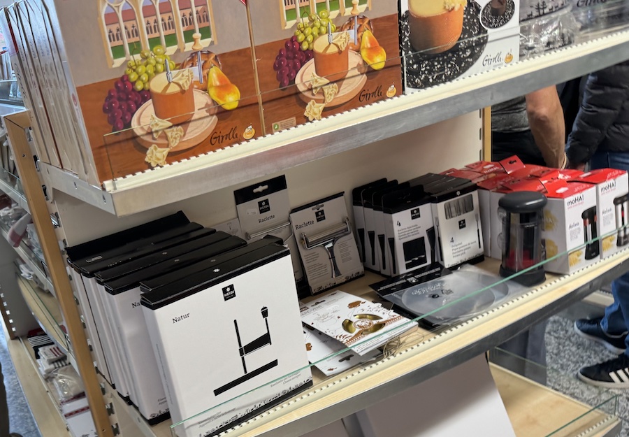 A gift shop filled with Swiss cheese, fondue sets, and souvenirs.