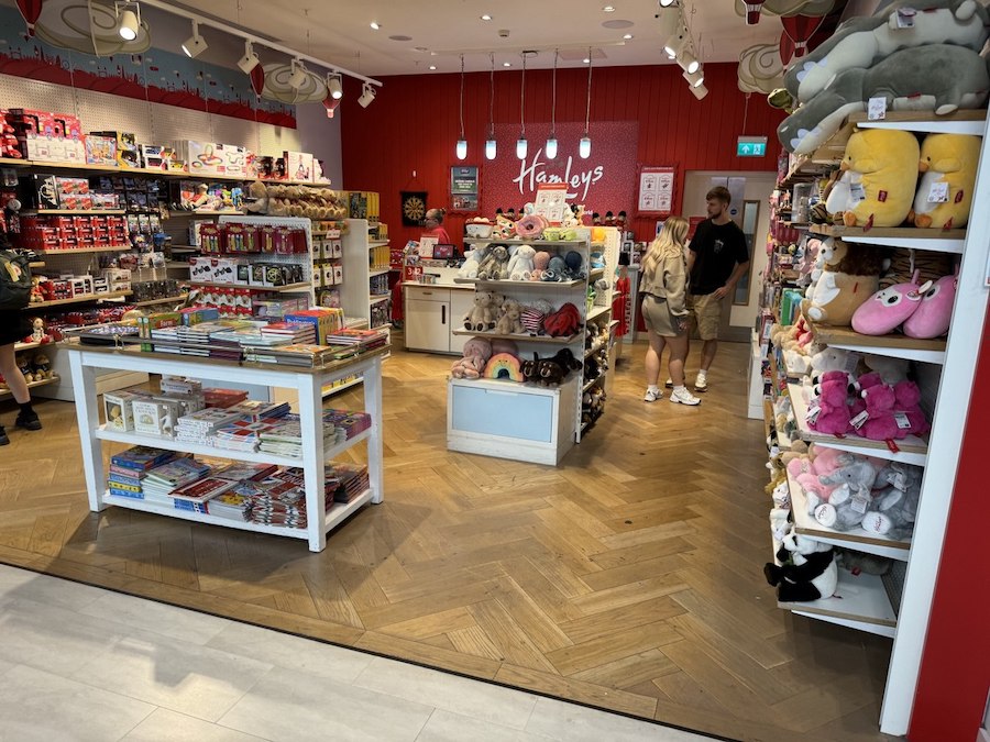 Shoppers browsing toys and displays at Hamleys Toy Store, London.