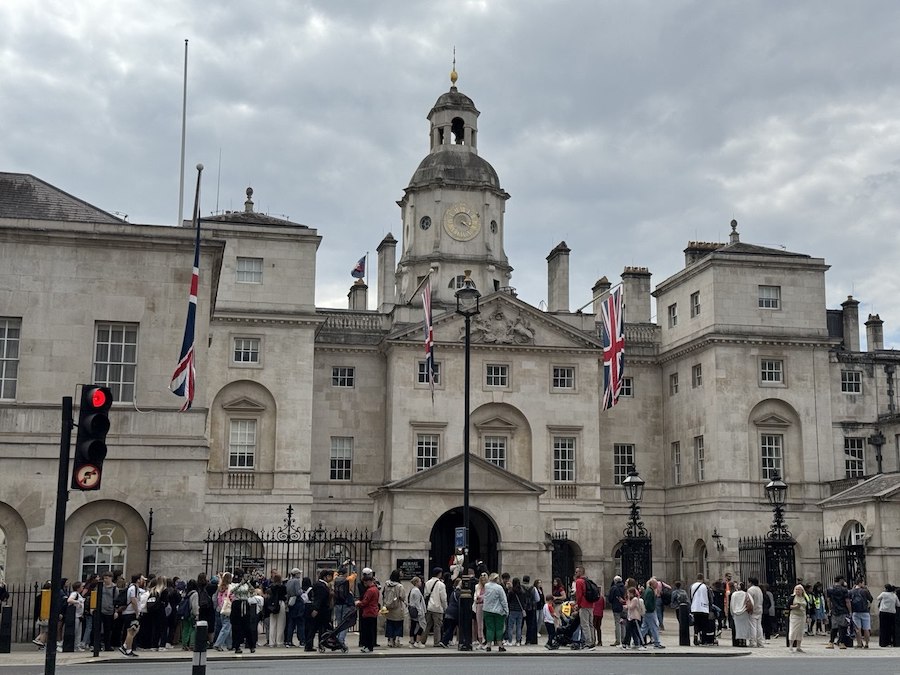 Historic Horse Guards building in London with mounted sentries on duty.