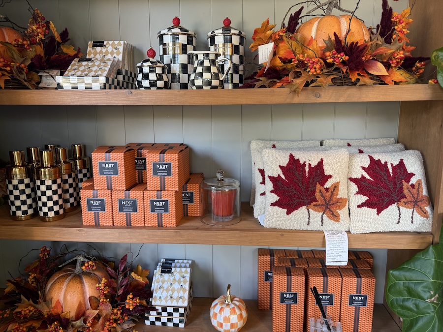 A store shelf is filled with a variety of autumn-themed merchandise.