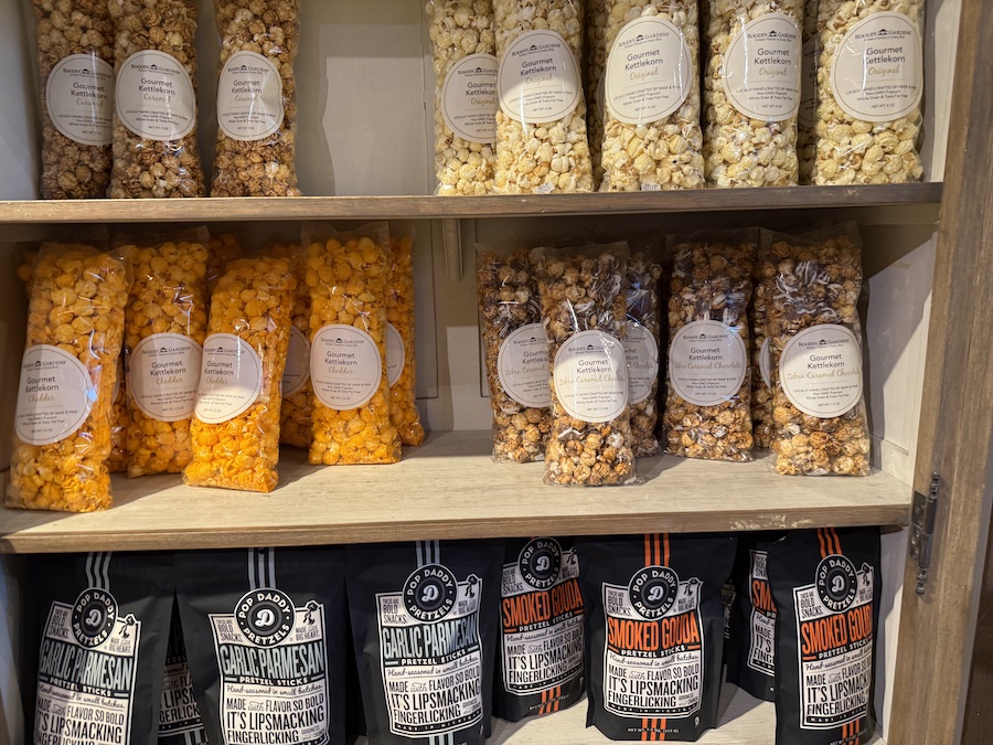 Shelves are stocked with packaged gourmet snacks.