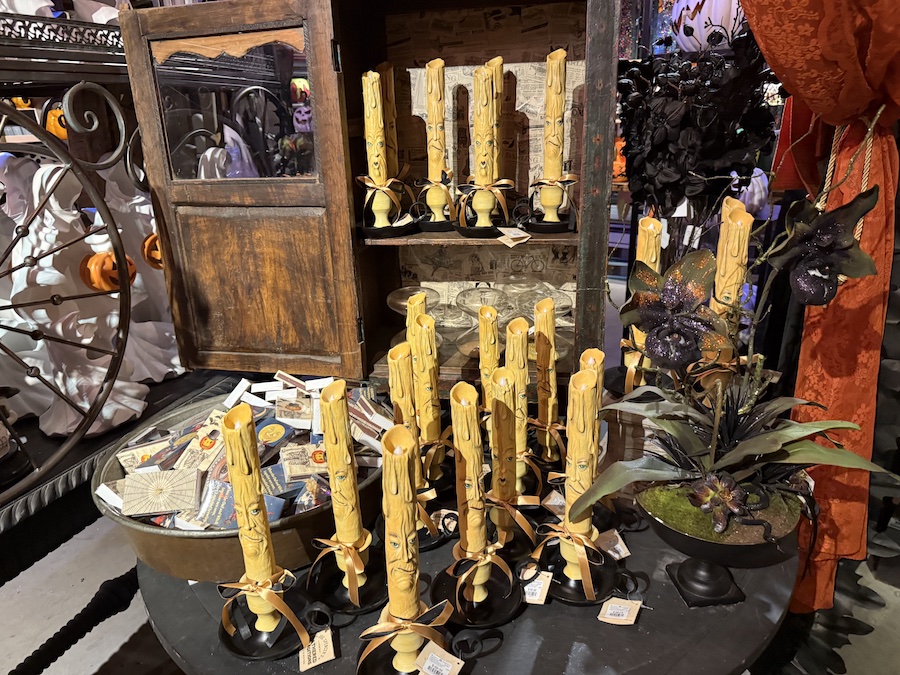Spooky candles arranged on gothic tables.