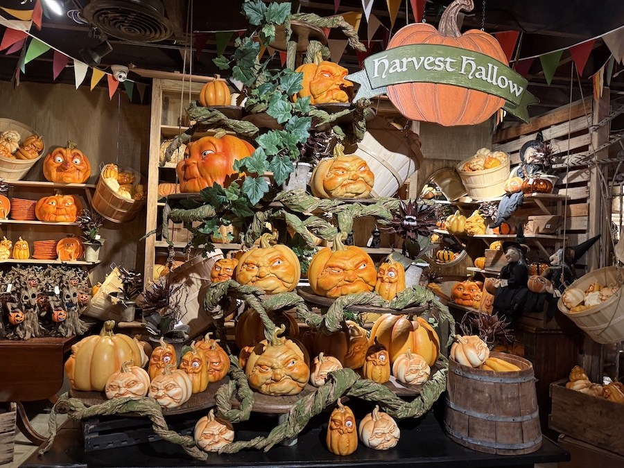 A large pumpkin installation in the middle of the hall.