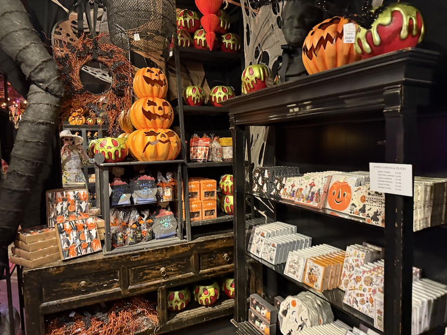 Witch-themed dessert plates stacked for display.