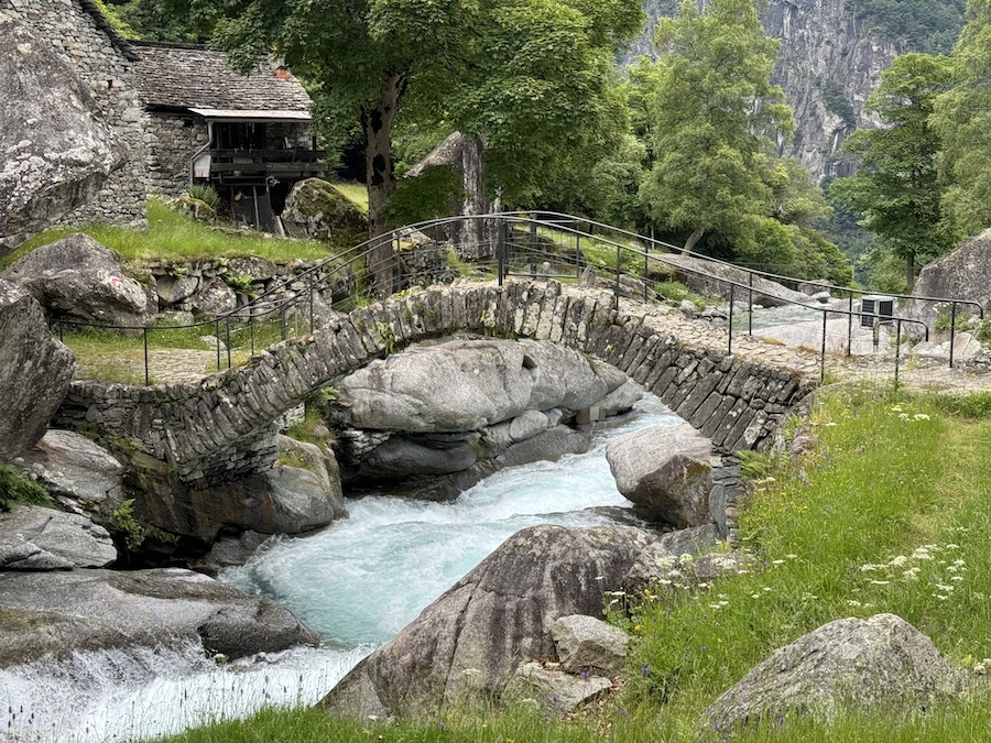 Stone bridge over turquoise waters in Bavona Valle.
