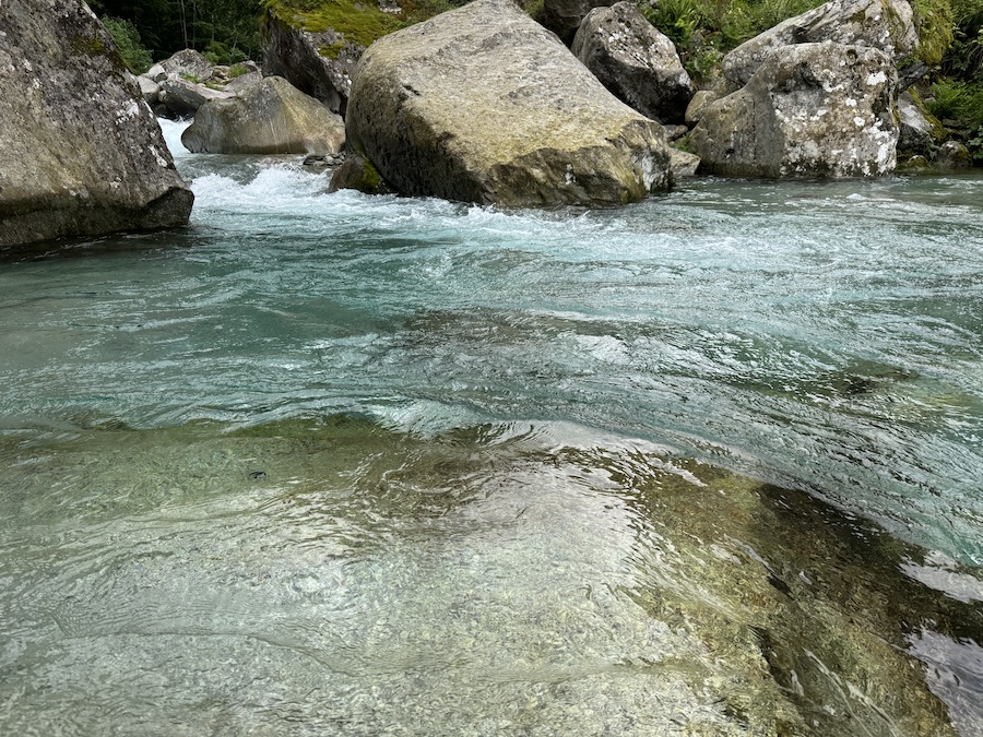 Mountain river with crystal-clear water in Ticino.