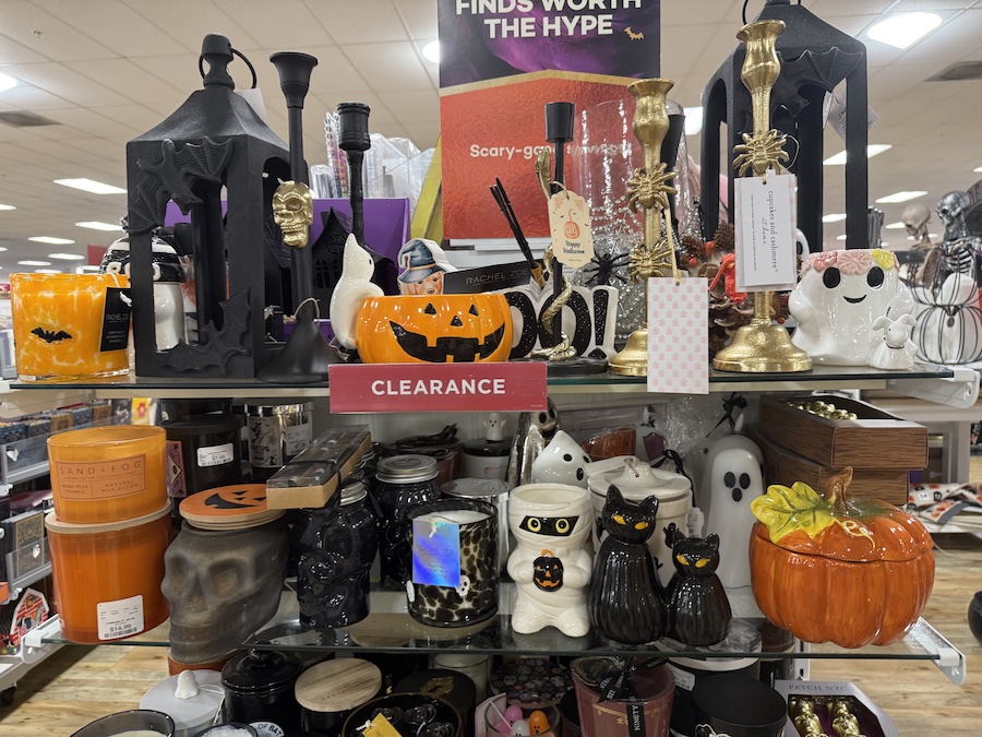 A "Clearance" shelf holds a variety of Halloween items.
