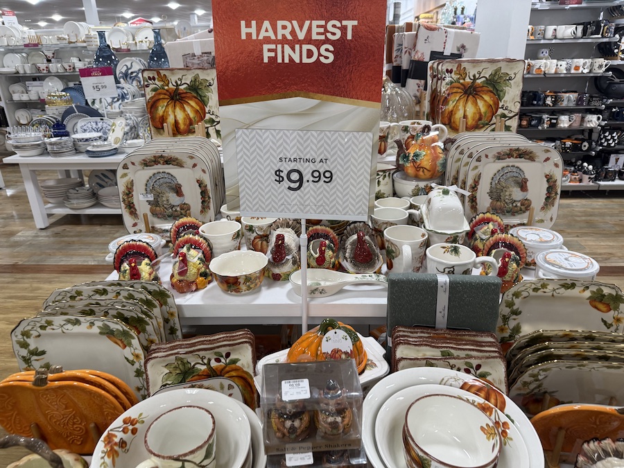 A large, central table display is dedicated to Harvest Finds, as indicated by a prominent sign.