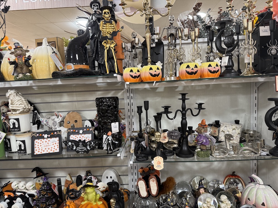 A shelf is dedicated to spooky Halloween decor.