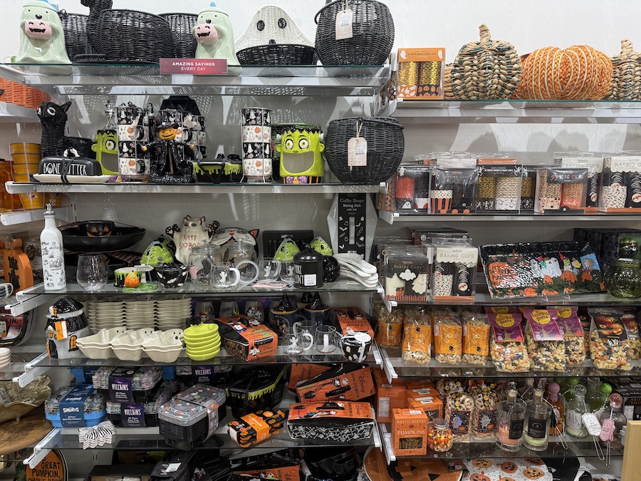 The shelves display a mix of spooky and whimsical items.