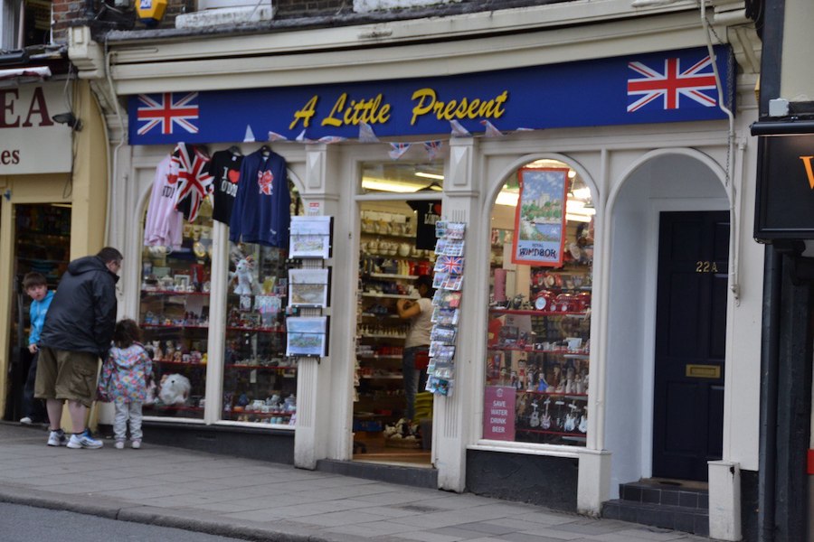 A souvenir shop named "A Little Present" is visible on a bustling street in Windsor.