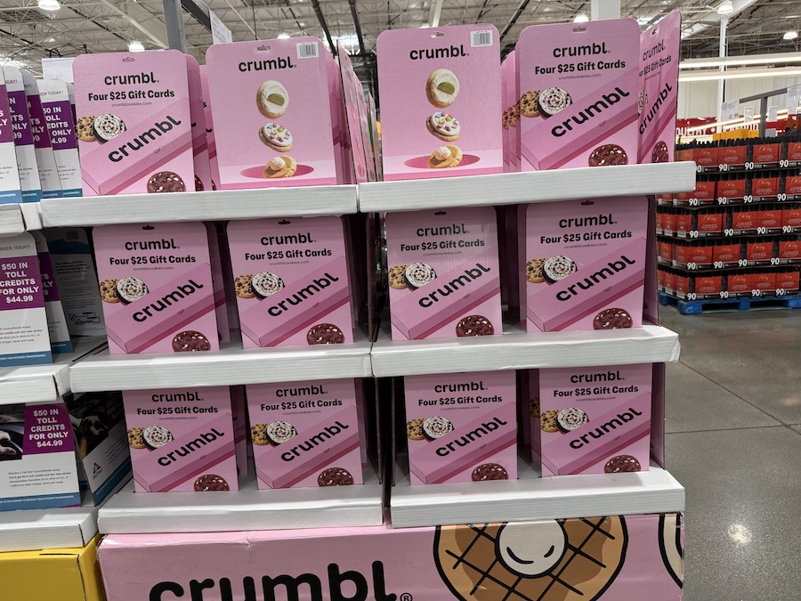 Crumbl Cookies Four Restaurant $25 Gift Cards multipacks displayed near the gift card wall.