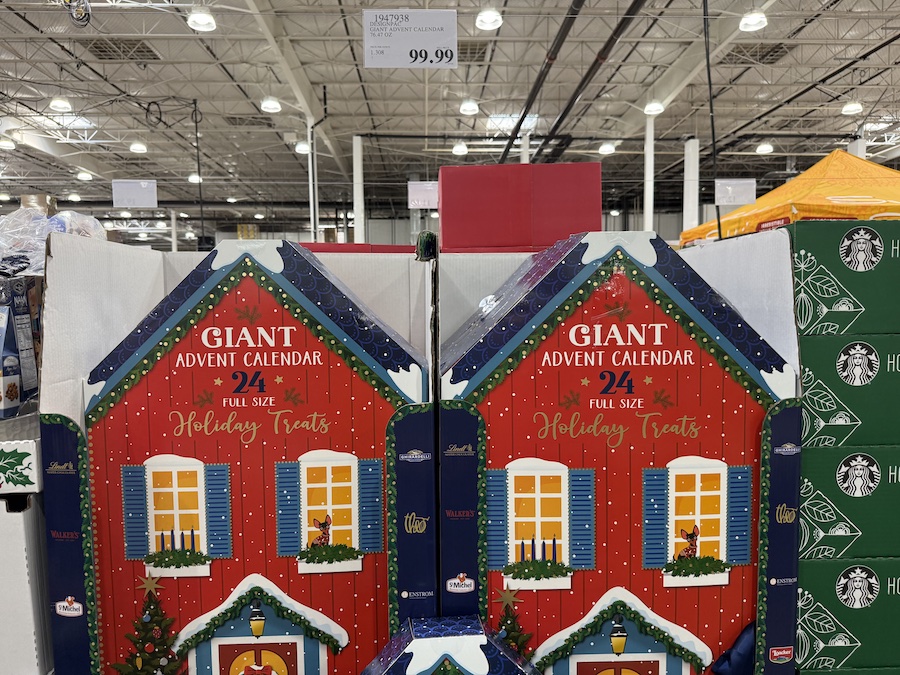 Oversized holiday advent calendar featuring chocolates and seasonal snacks behind each door.