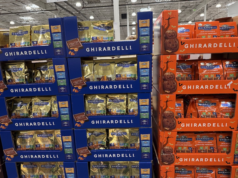 Gift bag filled with assorted Ghirardelli chocolate squares in festive foil.