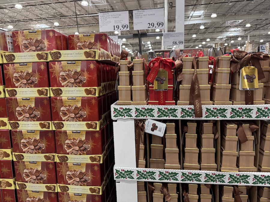 Elegant gold tower stacked with premium Godiva chocolates wrapped in festive ribbon.